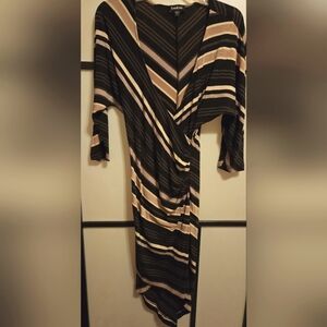 NWOT BEBE SEXY, DISCO stretch, striped, deep V neck, sexy dress. Longer in back.
